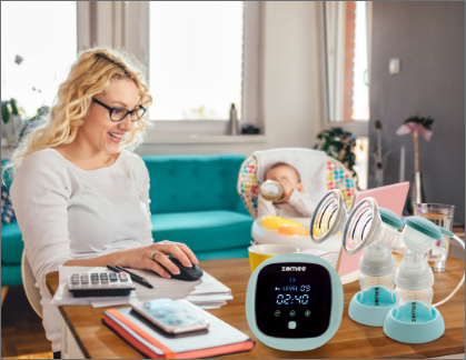 Woman with breast pump on desk