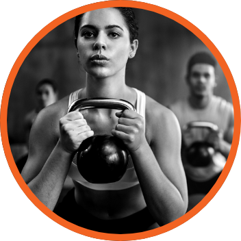 Woman holding kettlebell in gym