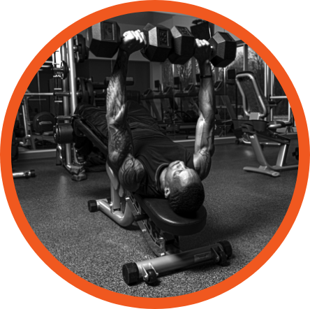 Man lifting dumbbells in gym