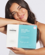 Woman holding box of Jan Marini product