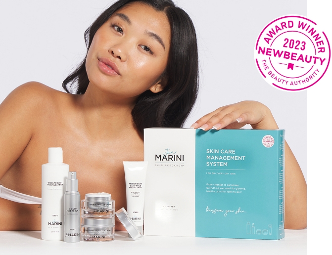 Woman displaying the Skin Care Management System from Jan Marini